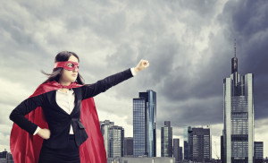 Female superhero standing in front of a city